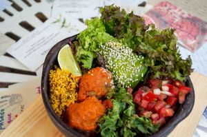 Lentil meatballs, pebre, avocado, cauliflower rice, grilled kale, greens. at Sapiens in Santiago