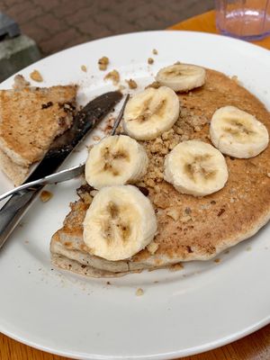 Vegan pancakes topped with banana at Jeannie's Great Maine Breakfast in Bar Harbor