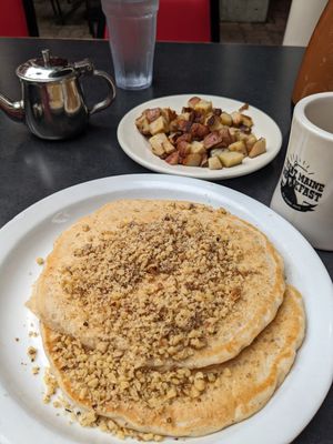 Oatmeal walnut pancakes with side of home fries at Jeannie's Great Maine Breakfast in Bar Harbor