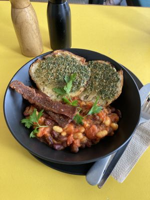 Beans with focaccia and a very delicious pesto!  at George Cafe in Mount Maunganui