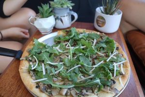 Schiacciata Fungi - sautéed mushroom, garlic, and rocket, lightly sprinkled with vegan cheese. 

A lunch special running this summer.  at Feed Me Pizza in Collinswood