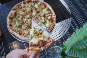 Smashed Potato - smashed garlic potatoes, garnished with fresh thyme and parsley, and lightly seasoned with sea salt.  at Feed Me Pizza in Collinswood