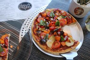 Gourmet Herbivore - roast pumpkin, artichoke, aubergine, roasted cherry tomatoes, red onion, and capsicum, topped with fresh basil.  at Feed Me Pizza in Collinswood
