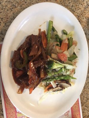 Vegan “steak” and fresh veggies in brown sauce.  at Coconutz Fusion Cafe in Miramar