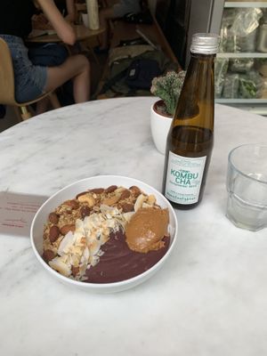 Acai bowl with granola, coconut, and peanut butter-best kombucha ive had  at My Goodness in Berlin