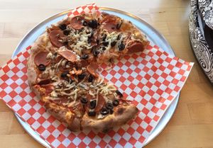 Olive, mushroom, vegan pepperoni and vegan cheese. at Bizza in San Francisco