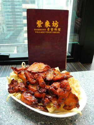 My favorite dish here: vegetarian BBQ pork with deep fried wonton at the bottom. Yum yum! at Harmony Village Vegetarian in Hong Kong Island