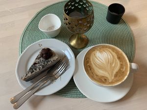 Liquorice cake & oat cappuccino  at Truefood Cafe in Lund