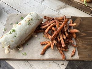 Falafel wrap with tahini dressing and sweet potato fries   at Om Is Where The Heart Is in Slaithwaite