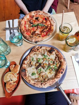 Truffle pizza, aubergine pizza, doughballs and their homemade cola. Amazing. Wow. at Purezza Camden in London