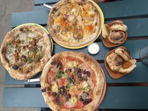 Clockwise - The one with all the seasons, Truffle mushroom pizza, Seaspiracy special pizza at Purezza Camden in London