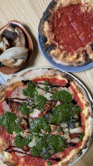 Pesto pizza (w/tomato base) & dough balls  at Purezza Camden in London