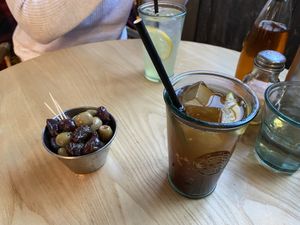 Homemade cola and olives for starter at Purezza Camden in London