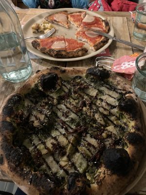 Pesto pizza: the best pizza I’ve ever had. The base (wholemeal) is incredible. In the background is my daughter’s gluten free pizza which she said was great. Kids eat free!   at Purezza Camden in London