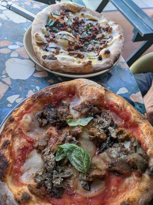 The first one is the Parmigiana pizza and the second one the porkies at Purezza Camden in London