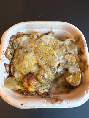 Cheesy Herbie potatoes (side dish). at Purezza Camden in London