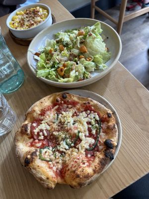 Vegan pepperoni individual pizza and side Caesar salad.   at Purezza Camden in London