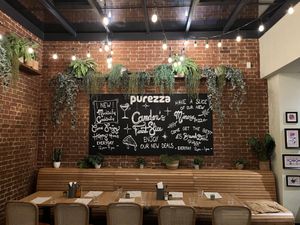 Specials board at back of restaurant  at Purezza Camden in London