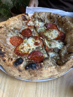 Truffle pizza with extra pepperonii  at Purezza Camden in London