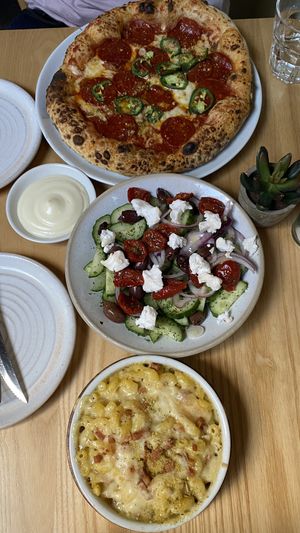 Pepperoni pizza, mediterranean salad, mac&cheese, garlic dip  at Purezza Camden in London