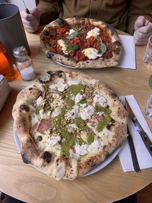 lasagne pizza and pistachio pizza  at Purezza Camden in London