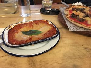 Lasagna and parmigiana pizza at Purezza Camden in London