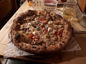 The Fall pizza (limited edition special dish) with truffles, tofu, cherry tomatoes and mozzarella (£14) at Purezza Camden in London