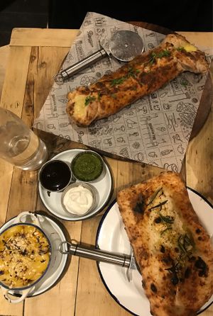 cheesesteak calzone, mac & cheese, garlic bread w/cheese at Purezza Camden in London