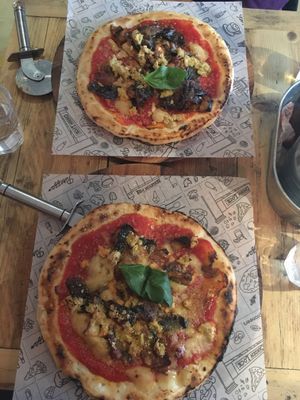 2 vegan parmigiana pizzas on gluten free base at Purezza Camden in London