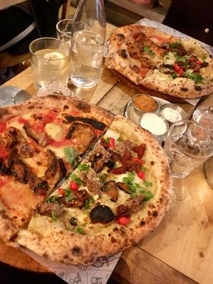 Half parmigiana party, half the special of the day at Purezza Camden in London