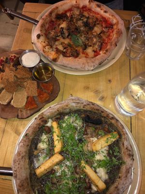 Truffle pizza, cheese platter, parmigiana pizza at Purezza Camden in London