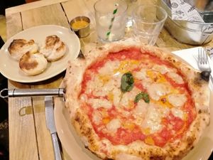 Dough balls and margherita pizza. Both amazing! at Purezza Camden in London