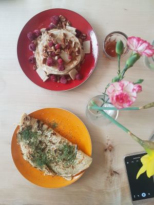 Delicious sweet and savoury pancakes (they also have a selection of sandwiches - or broodjes) 
Upper pancake: Stack of sweet pancakes with raspberries, home made white chocolate and pecans topped off with some maple syrup. 

Bottom pancake: Savoury pancake with aubergine cooked in it, flavoursome cream cheese inside and topped off with dill. 

Full of flavours. at Dunk Ontmoet in Groningen