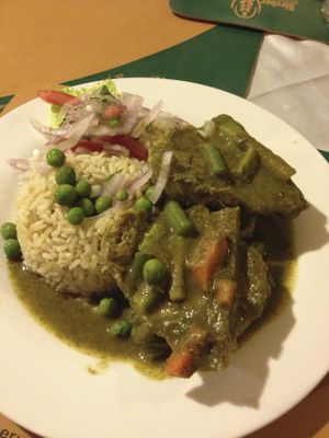 'Seco de Cabritovel' - Savory veggie cutlets smothered in a deep green corn-cilantro sauce. at Bircher-Benner in Lima