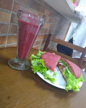 X-Salad - beetroot bread, falafel burger, cheddar, lettuce (burger and artisan bread) with blackberry juice at Bem Estar Emporio in Guarulhos