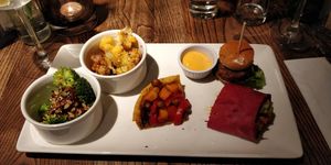 Broccoli with chilli jam, roasted cauliflower with giant cous cous, chickpea tart, moving mountains burger and BBQ jackfruit wrap. at The Church Mouse in Chester-le-street