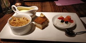 Winter berry crumble with custard, cheesecake and rice pudding. at The Church Mouse in Chester-le-street
