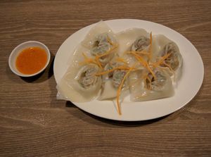 Dumplings with some sort of spicy dipping sauce at Genesis 创世界素食馆 in Central Singapore