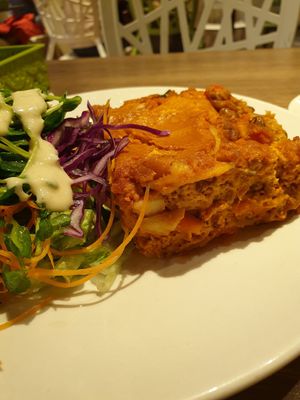 Lasagna with side salad at Genesis 创世界素食馆 in Central Singapore