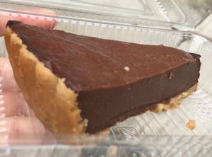 Off the menu seasonal special secret item - carob pie ?✌?️. Texture is like Jell-O. Not my type. I liked the crust, though! Same as the tofu cheesecake's ?  at Genesis 创世界素食馆 in Central Singapore