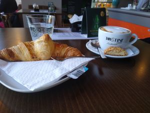 Cappuccino with croissant at Pestre in Bratislava