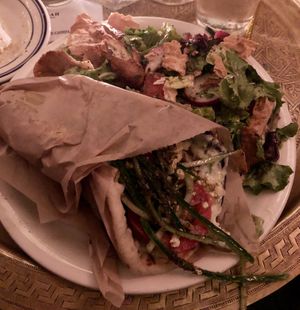 Huge Vegan Gyro (V) with seitan, tofu feta, and jalapeño cilantro tzatziki. Comes with a side salad.   at Kasbah Lounge in Sacramento