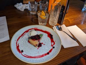 Warm vegan blueberry polenta cake with vegan vanilla ice cream  at The Castle in Wakefield