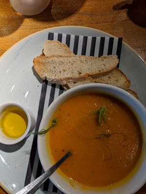 Carrot and coriander soup with vegan oil and bread. at The Castle in Wakefield