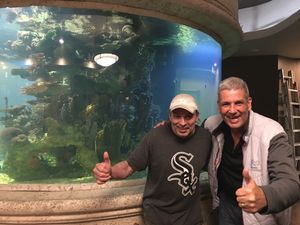 Chef Bill and my hubby Joe beside their beautiful 4500 Gallon aquarium  at Ek's Grill in Kelowna