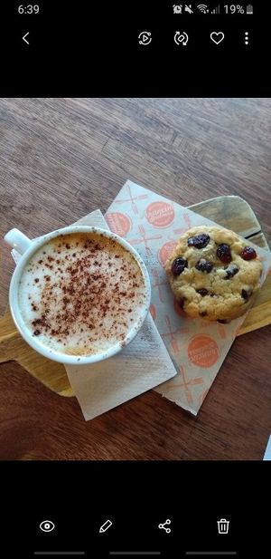 Cappuccino with oat milk and vegan chocolate chip cookie at Arancini Brothers - Old St in East London