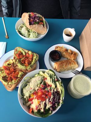 Avocado bowl, jackfruit pitta, sausage pastry and matcha latte at Earth Cafe in Cork