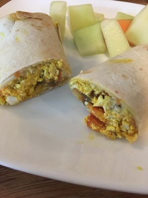 Vegan Cheesy Breakfast Burrito with fruit at Twisted Tree Cafe in Asbury Park