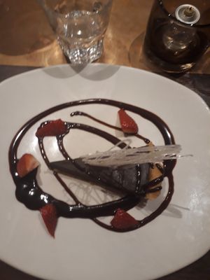 Chocolate tart
Chocolate tart topped with chocolate sauce and fresh berries  at The Arkle Manor in Betchworth