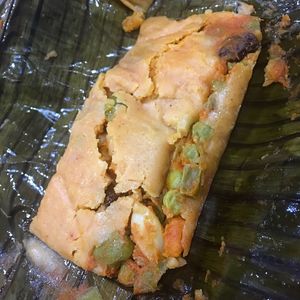 Mixed vegetable tamale wrapped in banana leaf  at Don Andres Taqueria Vegana in Mexico City